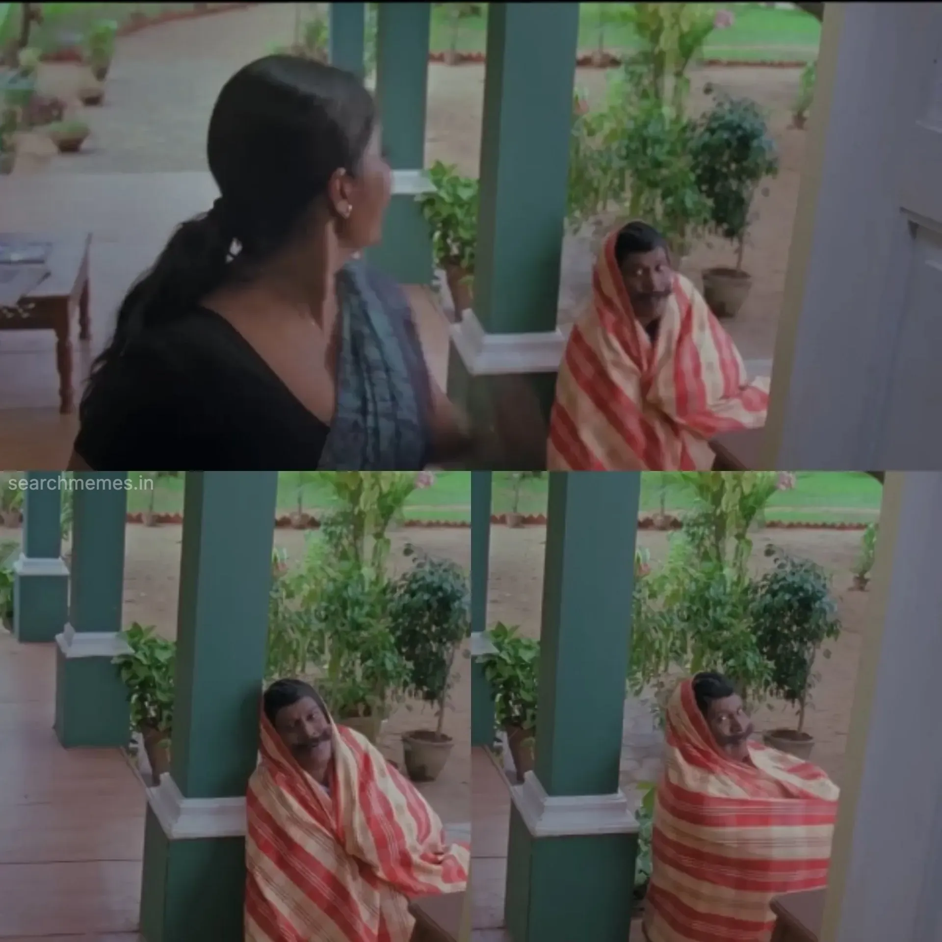 Vadivelu wrapped in a warm blanket leaning on a pillar on a porch