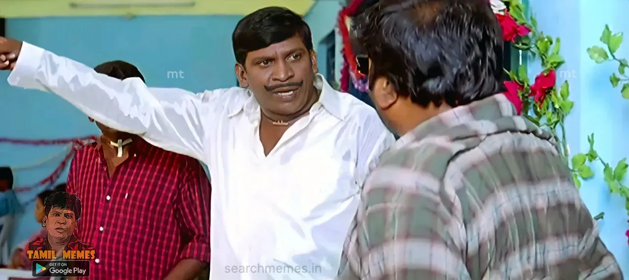 Vadivelu listening attentively to bizarre instructions from his companion