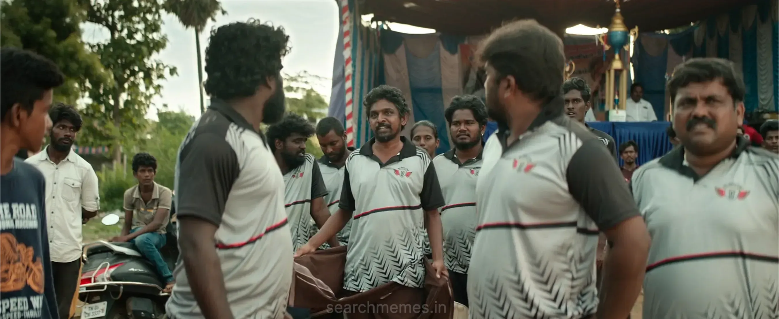 Jenson Diwakar standing in a cricket jersey speaking with swagger to his village team