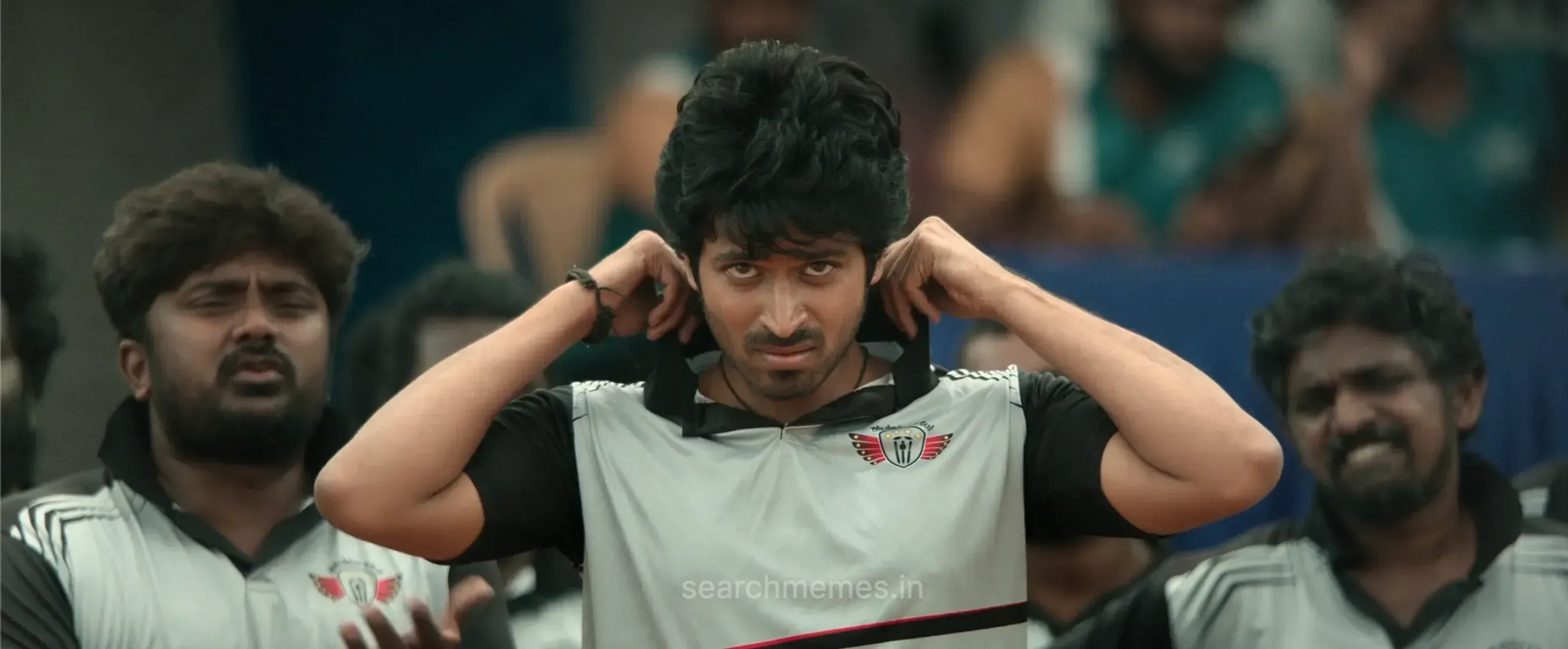 Harish Kalyan lifting his collar with a confident stylish smile