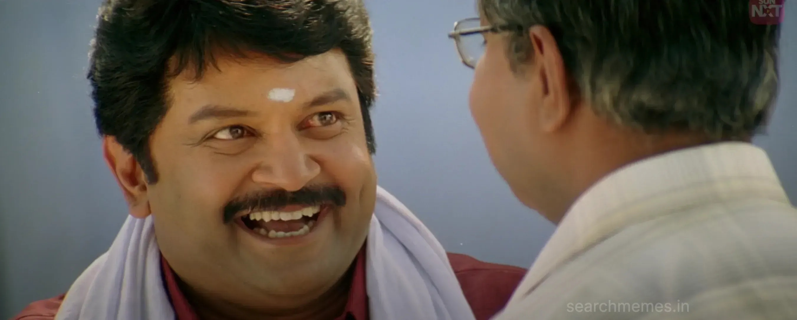 Prabhu smiling heartily with a tilak on his forehead in Something Something Unakkum Enakkum
