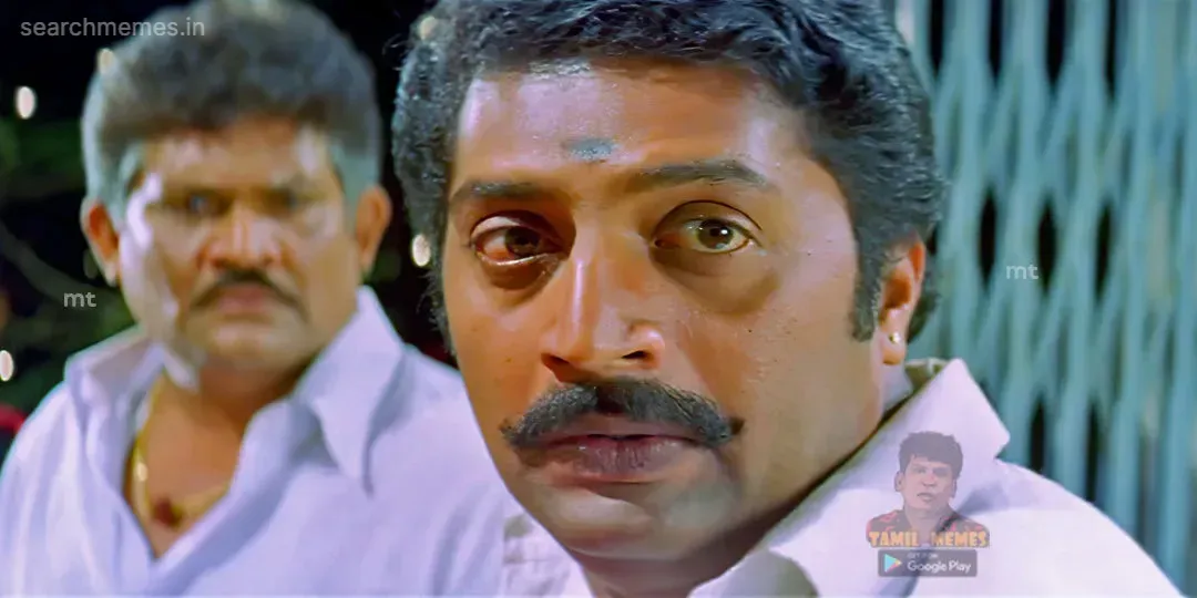 Prakash Raj with eyes wide open looking shocked in Ghilli