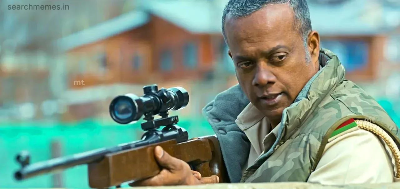 Gautham Vasudev Menon holding a sniper rifle with a puzzled look in Leo