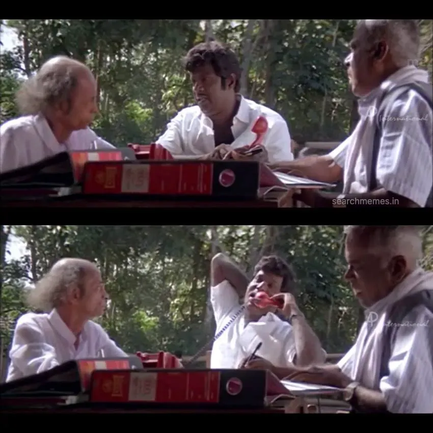 Goundamani holding a phone handset with a loud agitated expression