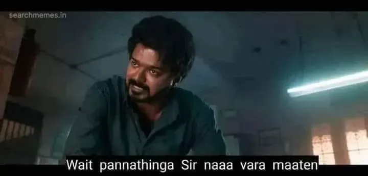Vijay in a dark shirt looking aside while stating he will not be arriving