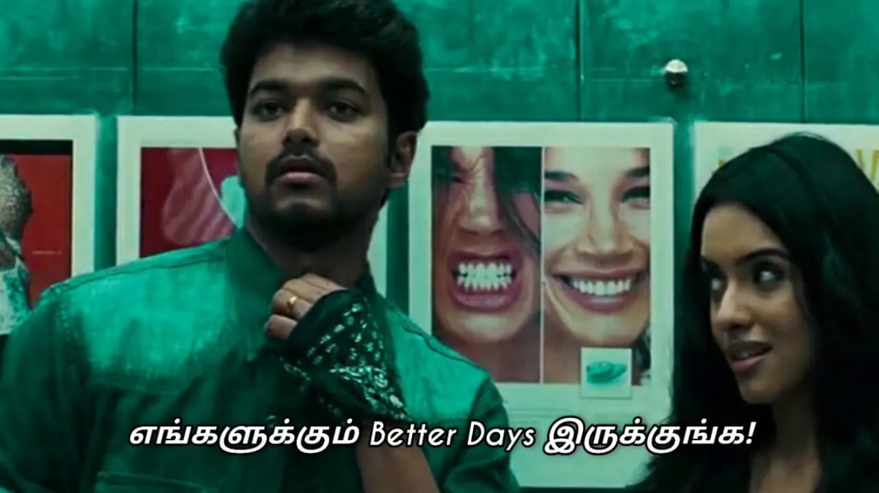 Vijay adjusting his wrist gear while looking forward with Asin looking on by his side