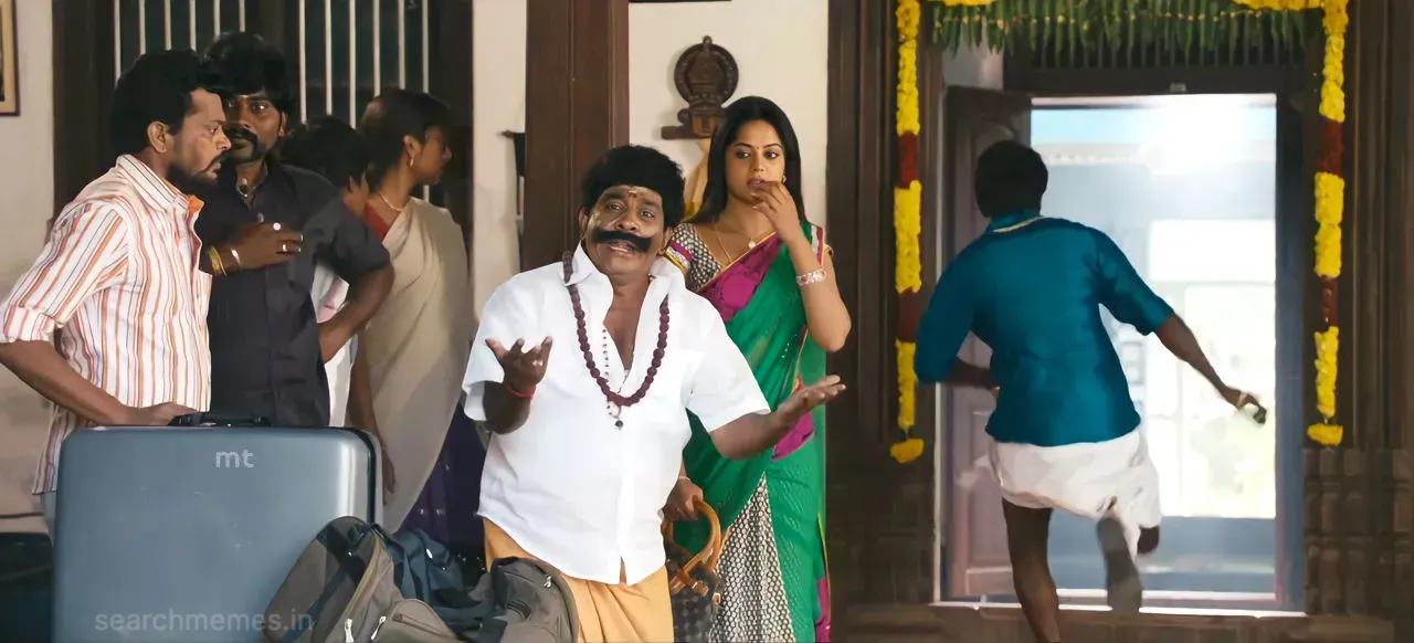 Singamuthu spreading both hands open in complete confusion indoors