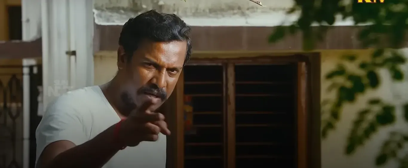 Samuthirakani speaking firmly with a stern fatherly expression