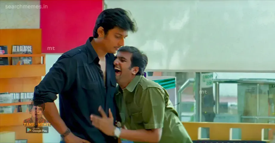 Santhanam holding Jiiva by his shirt and laughing hysterically in Siva Manasula Sakthi