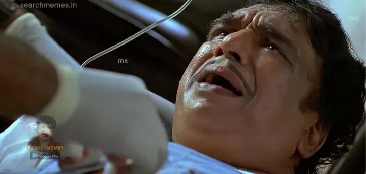 Cochin Haneefa lying on a hospital bed looking up with worried expression