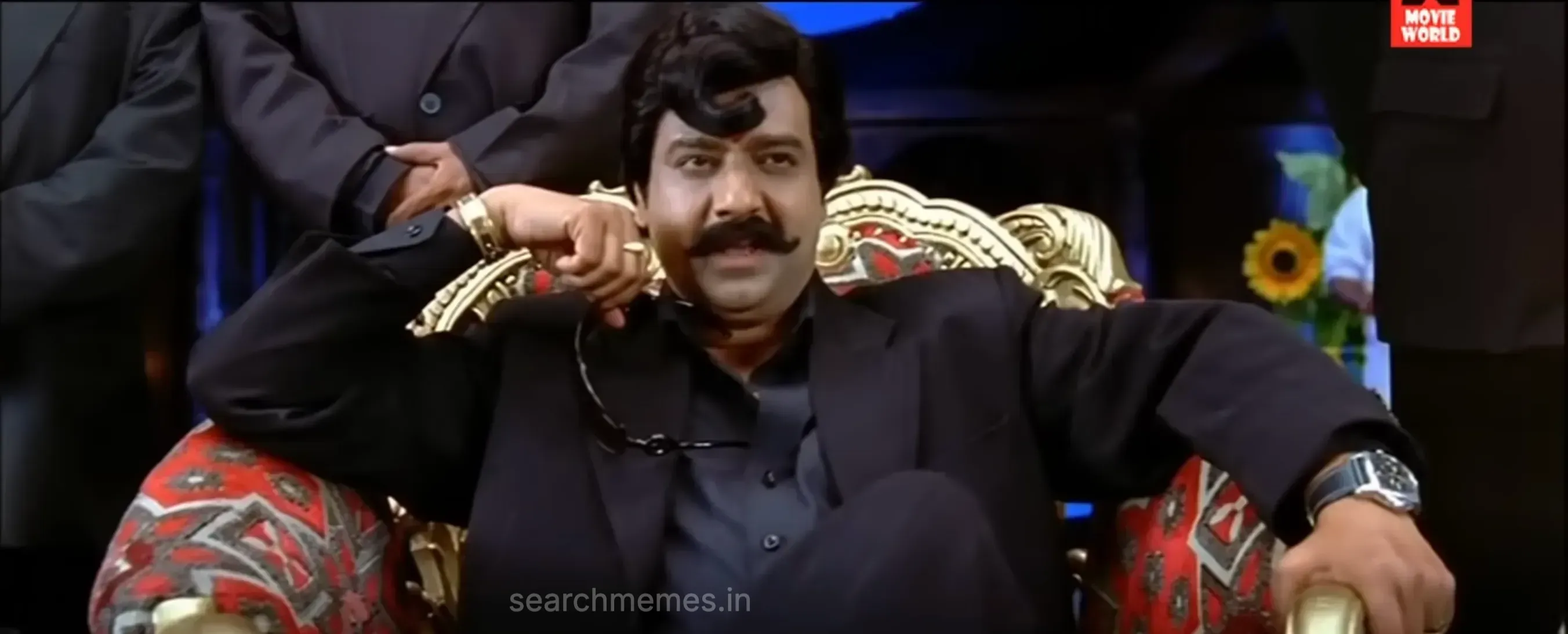 Vivek pointing animatedly while laying out territory terms to mobsters