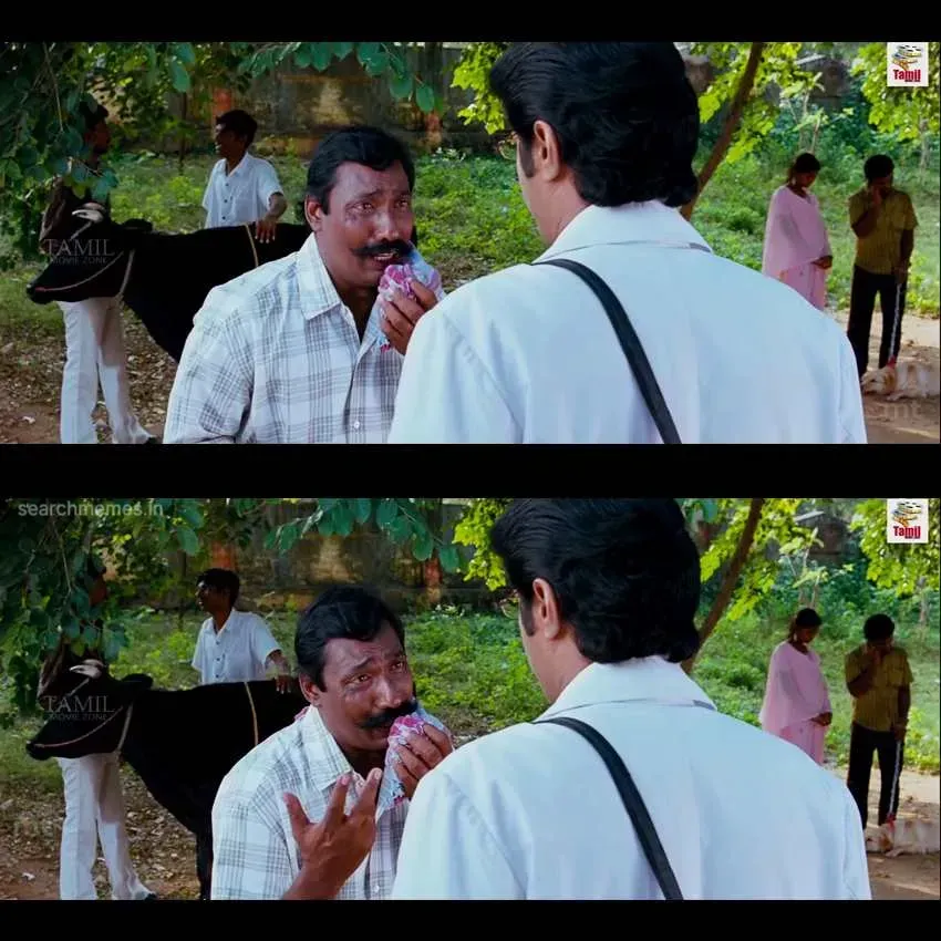 An older man teasing Santhanam while Arya looks on with amusement