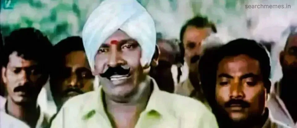 Vadivelu looking shocked and waving his hands in protest at night