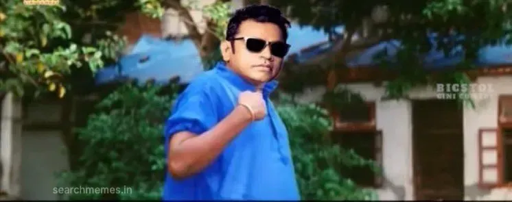 AR Rahman face edited onto Vadivelu in a blue shirt pointing to himself