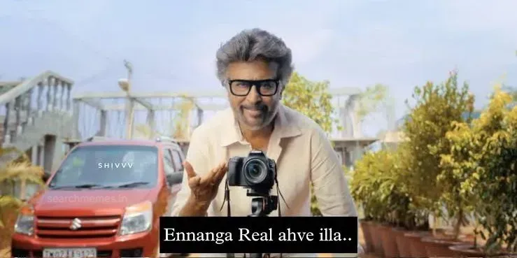 Rajinikanth standing behind a camera on a tripod gesturing gently in Jailer