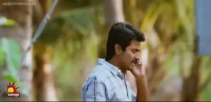 Sivakarthikeyan speaking on a mobile phone outdoors with serious concern
