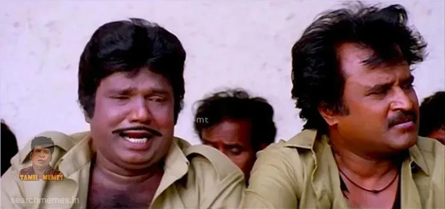 Goundamani crying dramatically next to a weary Rajinikanth in factory worker uniforms