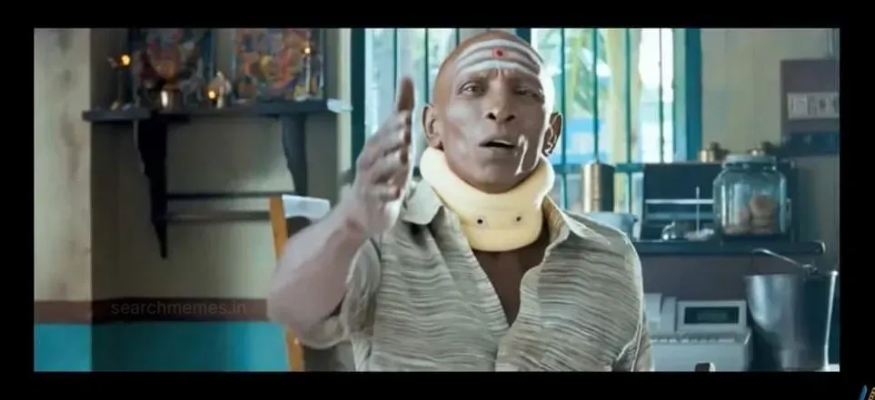Mottai Rajendran wearing a neck collar raising his hand dismissively in Pattathu Yaanai