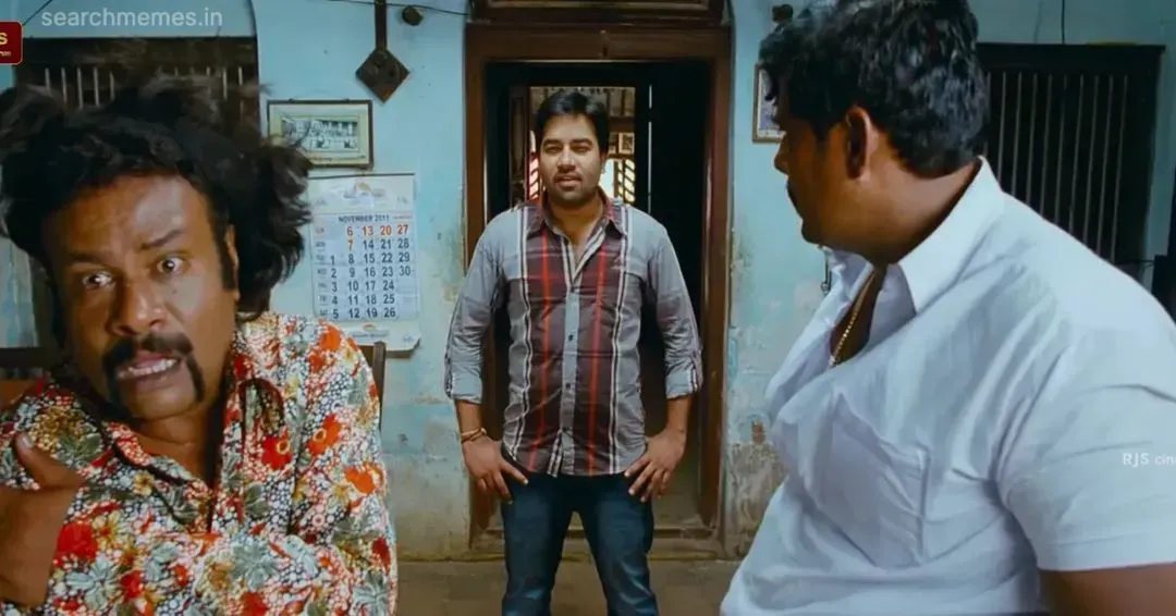 Mirchi Shiva pointing backwards with an alarmed comedic face warning others