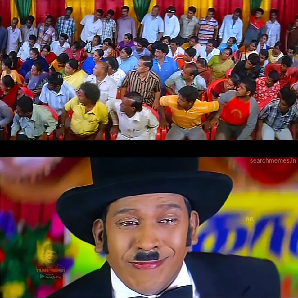 Audience looking back above Vadivelu wearing a top hat with a forced smile