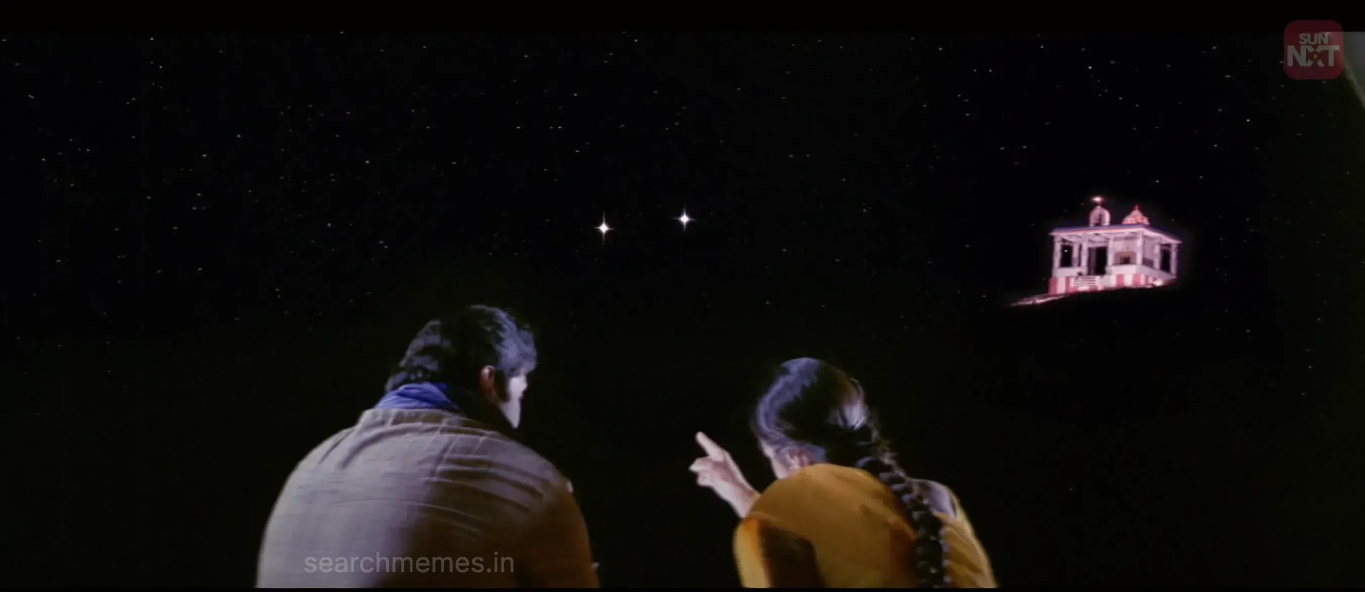 Prabhu and Trisha gazing up together peacefully at the night starry sky