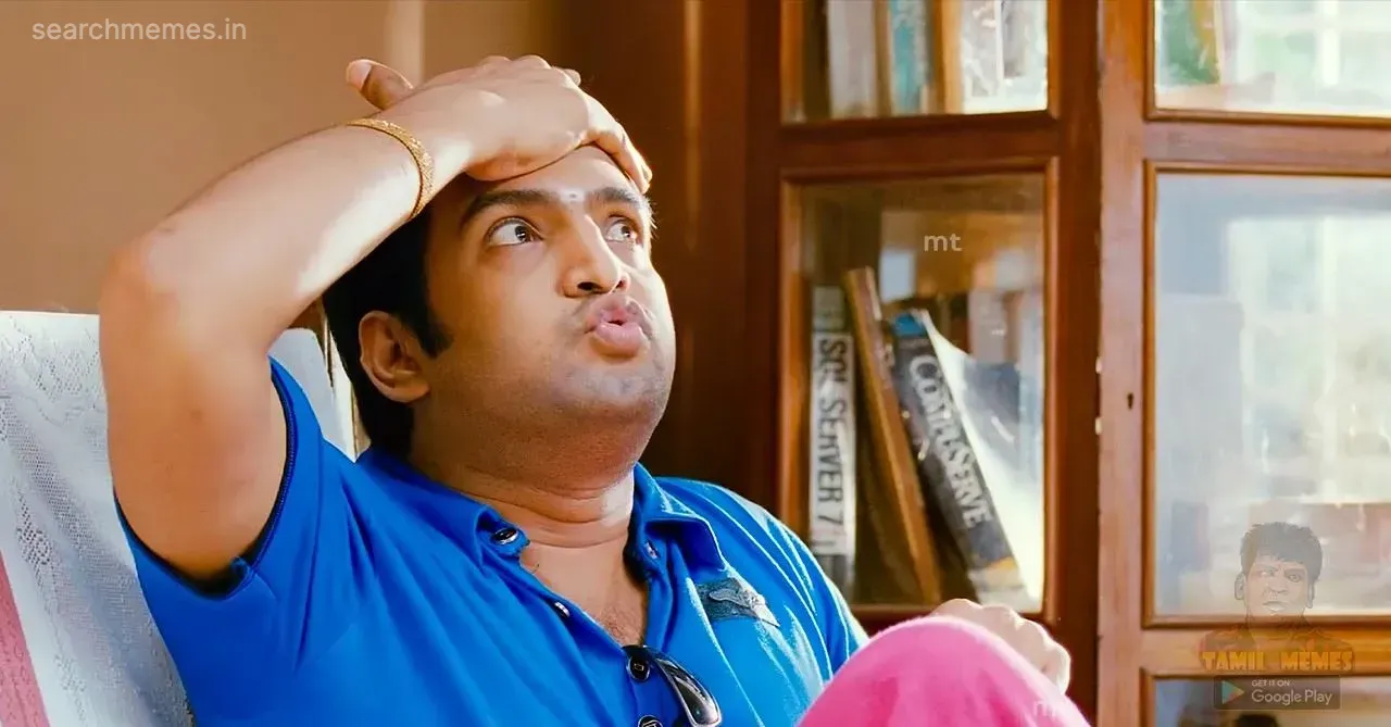 Santhanam with a hand on his forehead, looking flustered, as if remembering something he forgot.