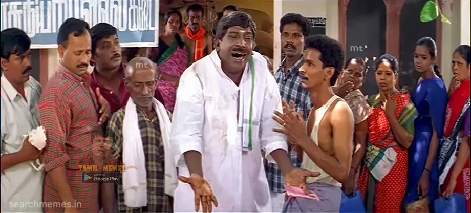 Vadivelu weeping openly in front of a gathered crowd with outstretched hands