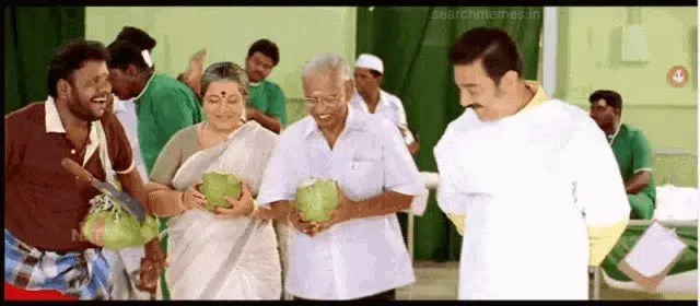 Kamal Haasan wearing a doctor coat while family smiles admiringly in Vasool Raja MBBS
