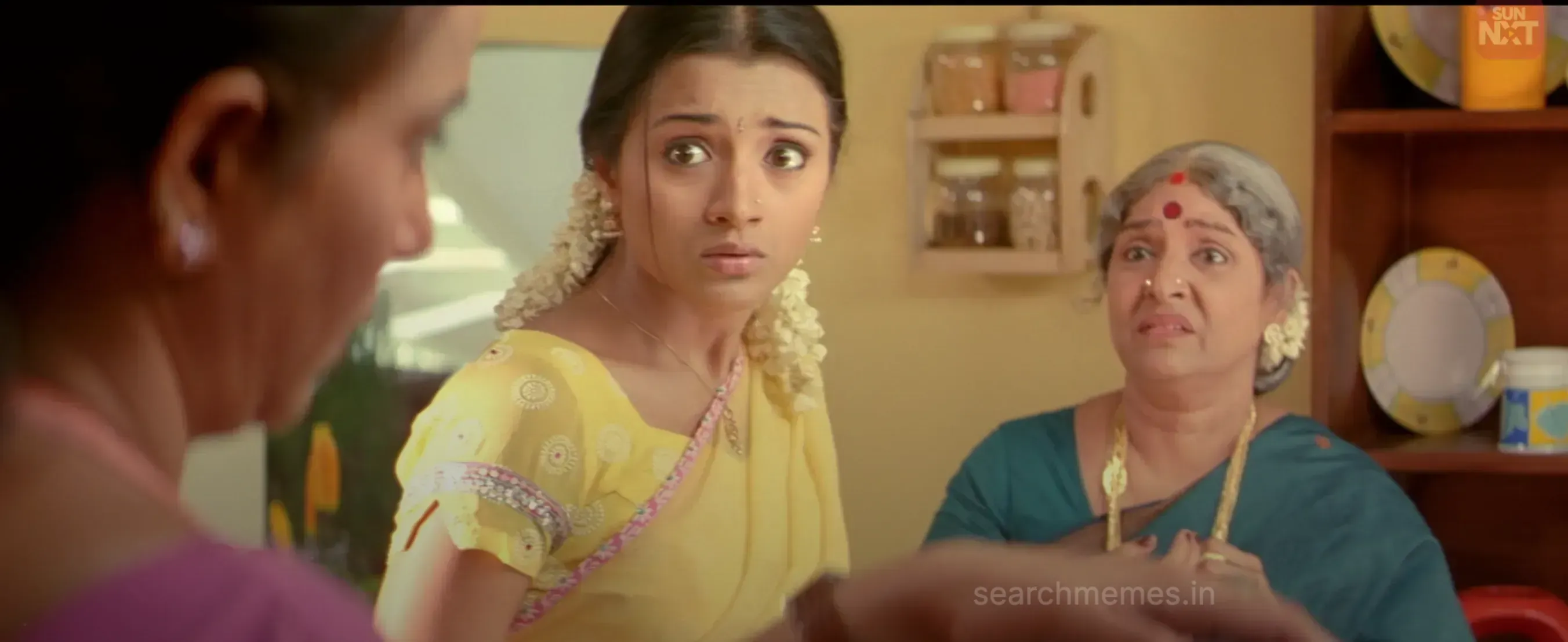 Trisha looking up with startled wide eyes in complete panic