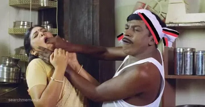 Vadivelu holding a woman by the mouth and throat in an aggressive comedic scuffle