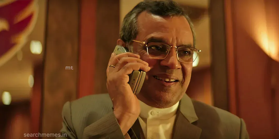Paresh Rawal with a cold calculating corporate expression addressing an opponent