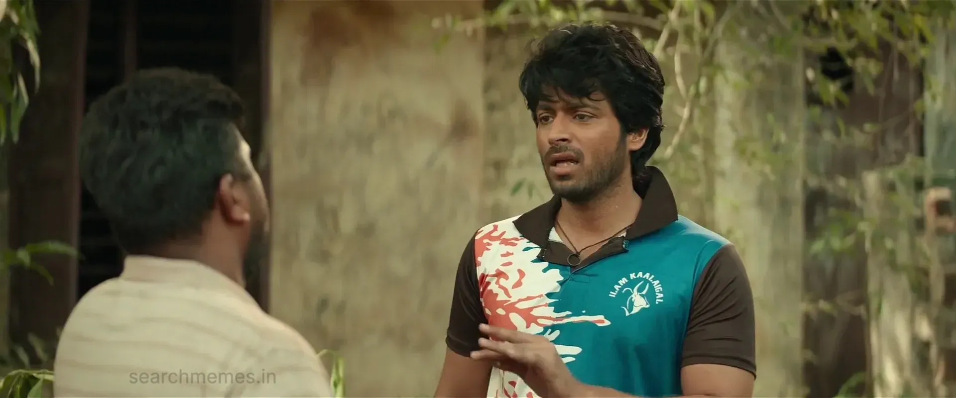 Harish Kalyan gesturing dismissively with his hand while speaking outdoors