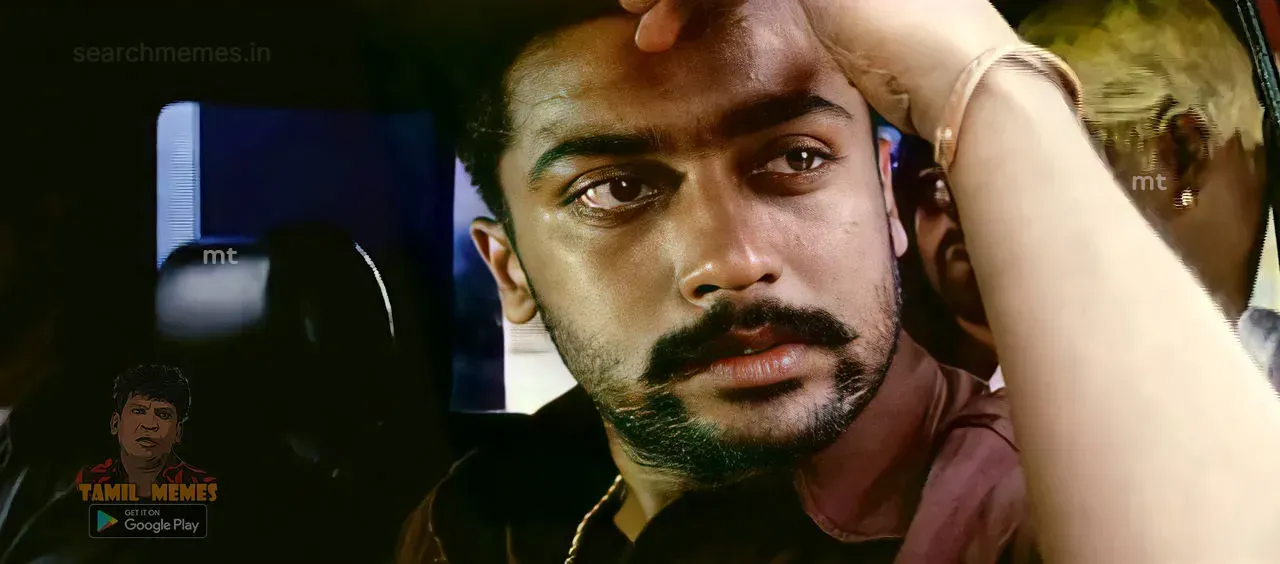 Close-up of Suriya resting his hand over his head and looking outside a car window