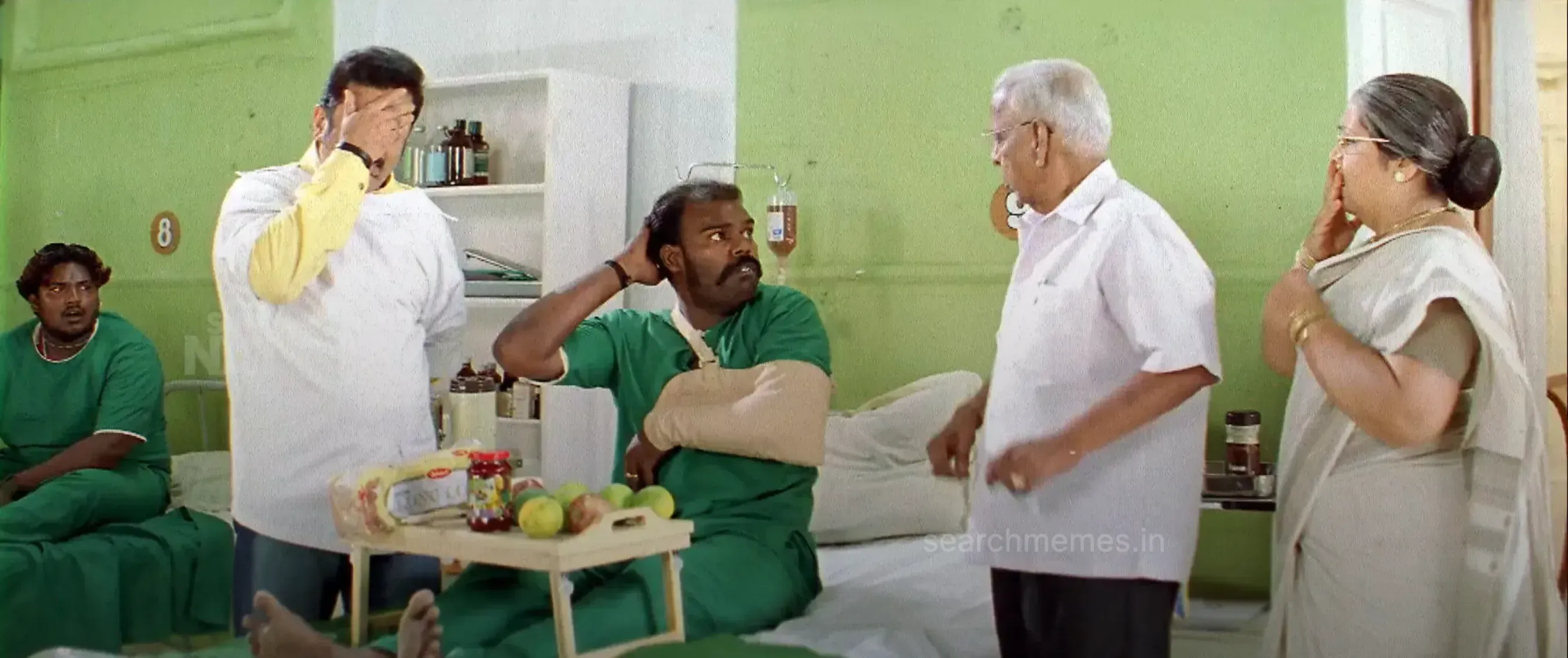 Nagesh berating a patient wearing a hand bandage with an exasperated face