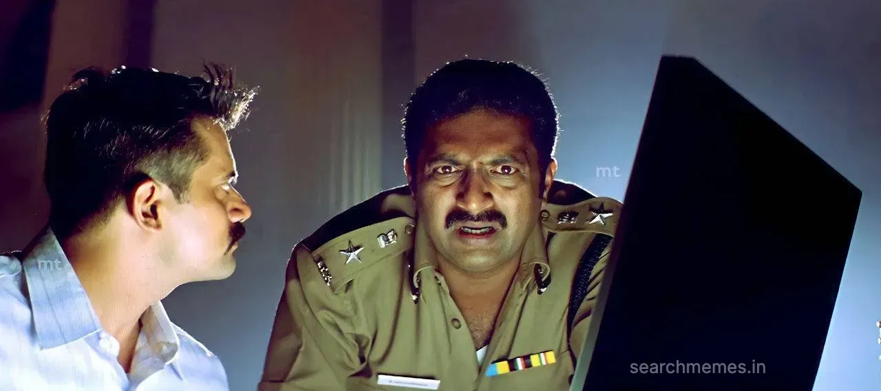 Prakash Raj in a police station tapping a pen on his chin thoughtfully
