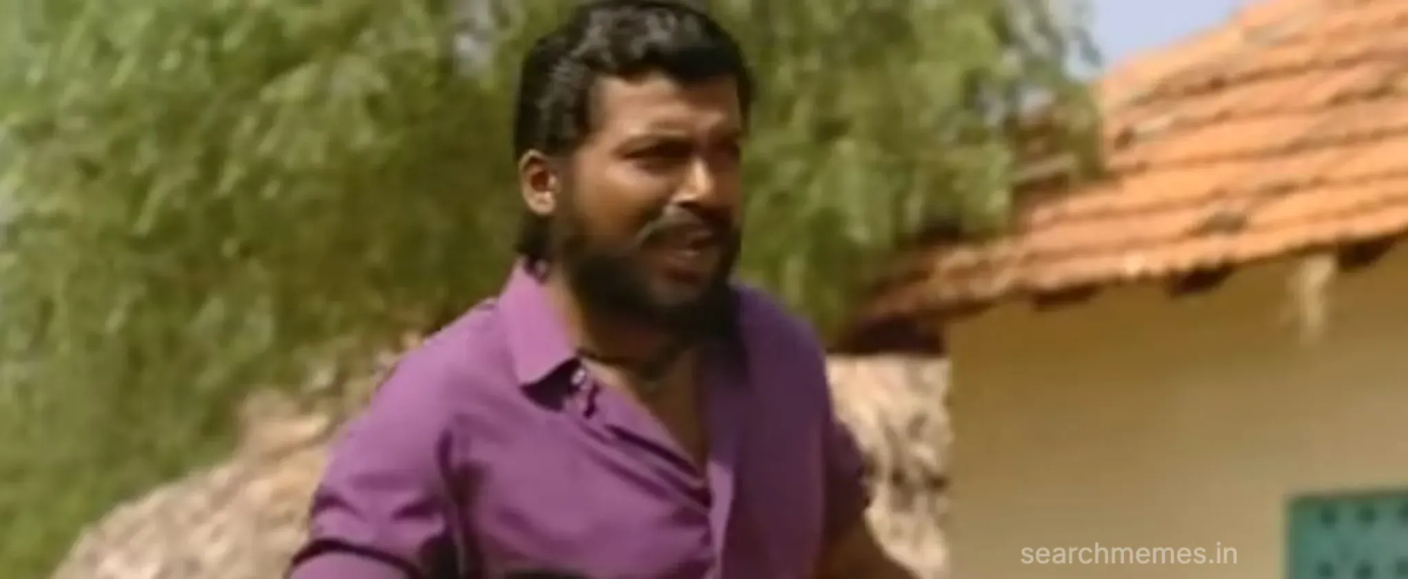 Karthi speaking with a confident and slightly arrogant expression from Paruthiveeran.