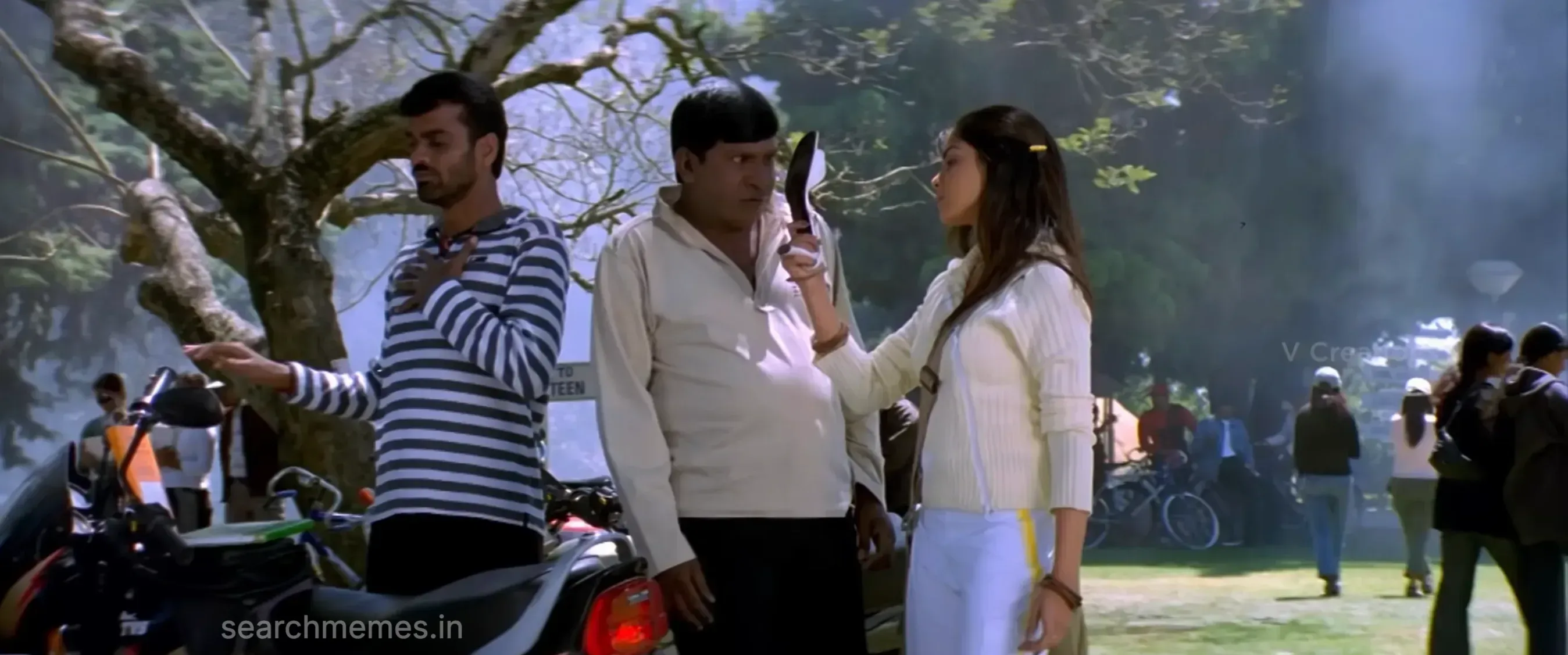 Vadivelu cowering with wide frightened eyes as someone raises a slipper